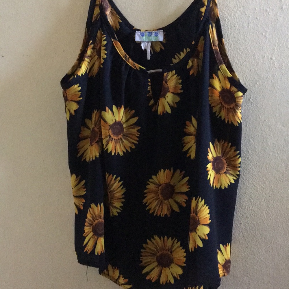 Sleeveless sunflower blouse.